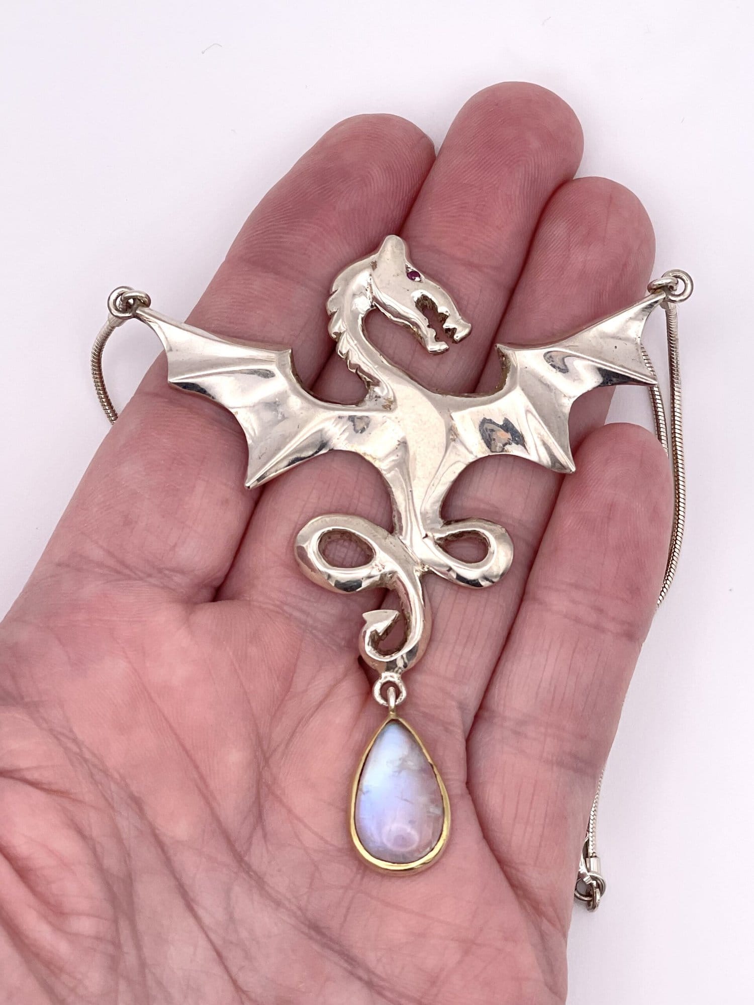 thumbnail interactive-video image 1 of Natural White Moonstone Opal Dragon Healing Pendant Necklace – Silver Plated, 17-inch Chain 1 of 5
